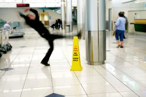 man falling on wet floor 